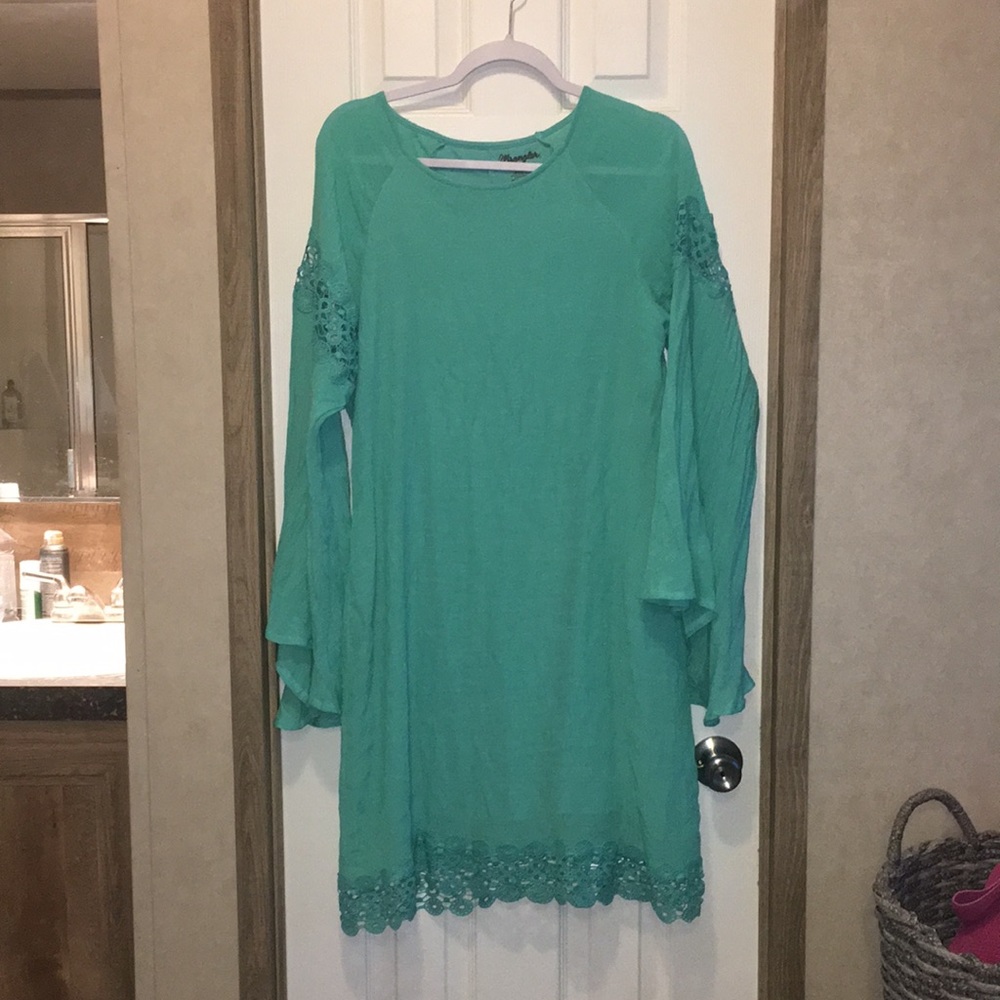 Wrangler, turquoise dress with bell sleeves and lace detailing.